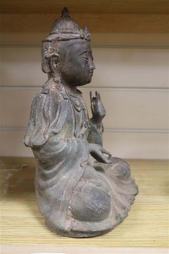 A Ming style bronze figure of a Buddha